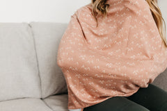 Copper Pearl Rocky shopping cart cover protects baby during errands.