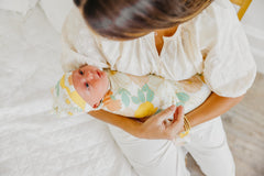 Copper Pearl Rose swaddle blanket used as cozy receiving blanket on the go.