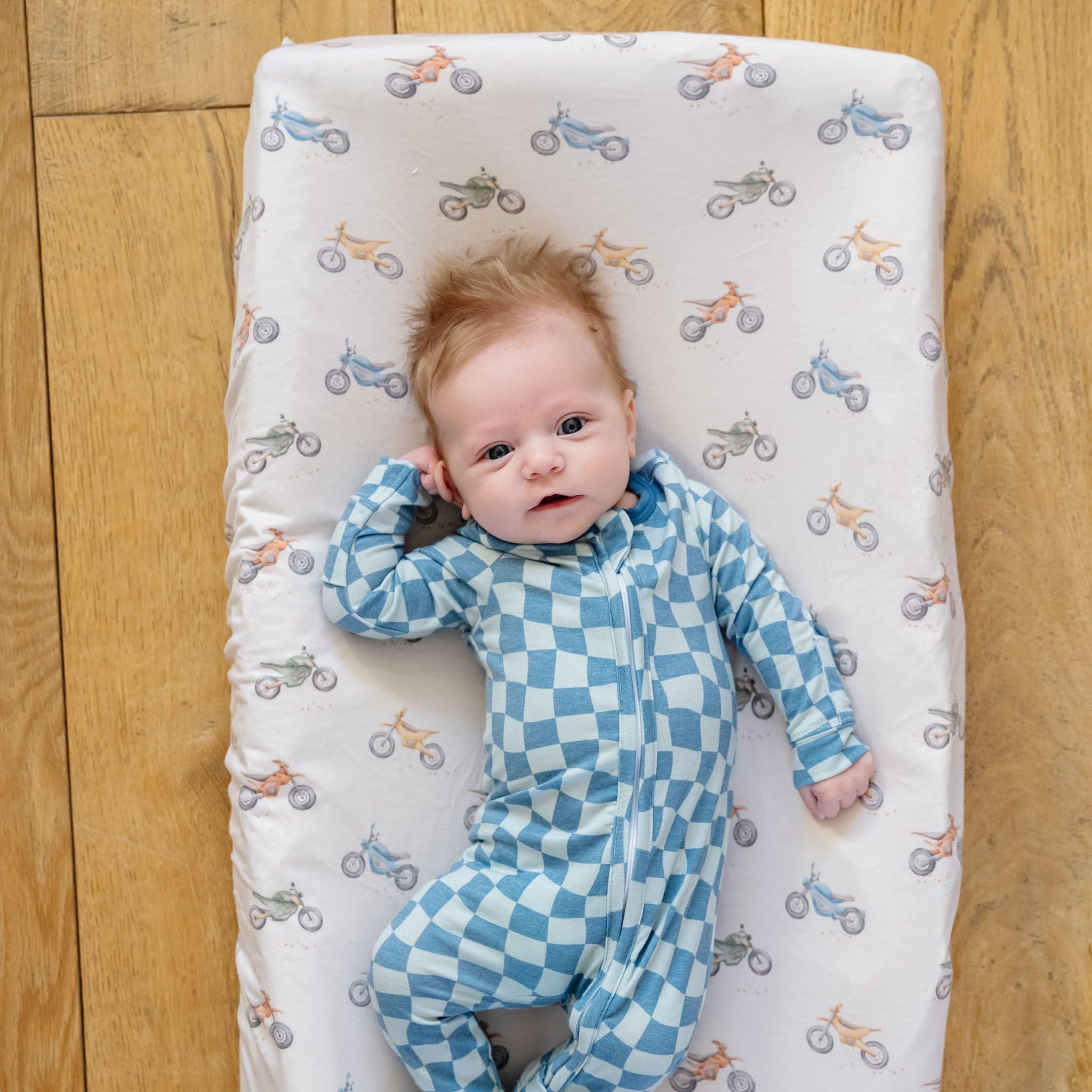 Copper Pearl Ryder knit cover coordinates with nursery decor for a cohesive look.
