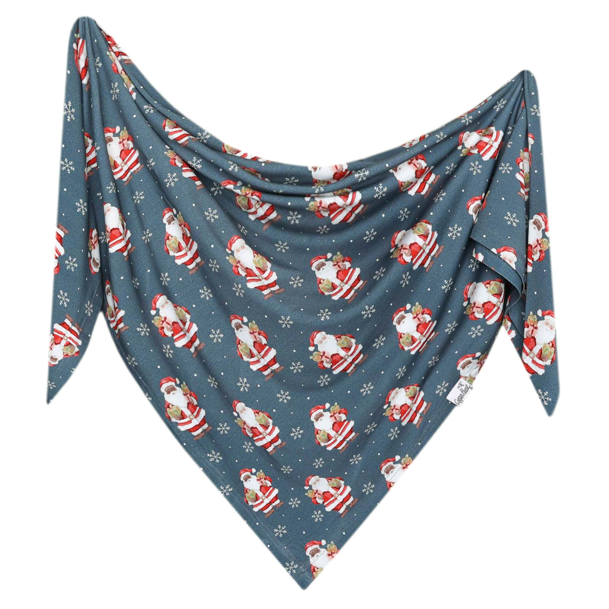 Close-up of Copper Pearl Santa Claus swaddle fabric showing softness and gentle stretch
