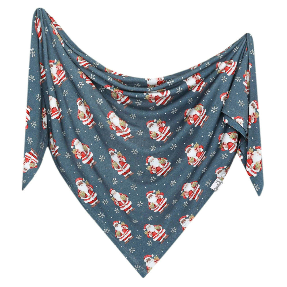 Close-up of Copper Pearl Santa Claus swaddle fabric showing softness and gentle stretch