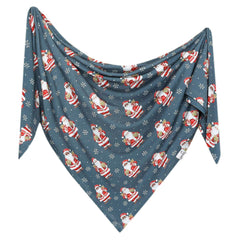 Close-up of Copper Pearl Santa Claus swaddle fabric showing softness and gentle stretch