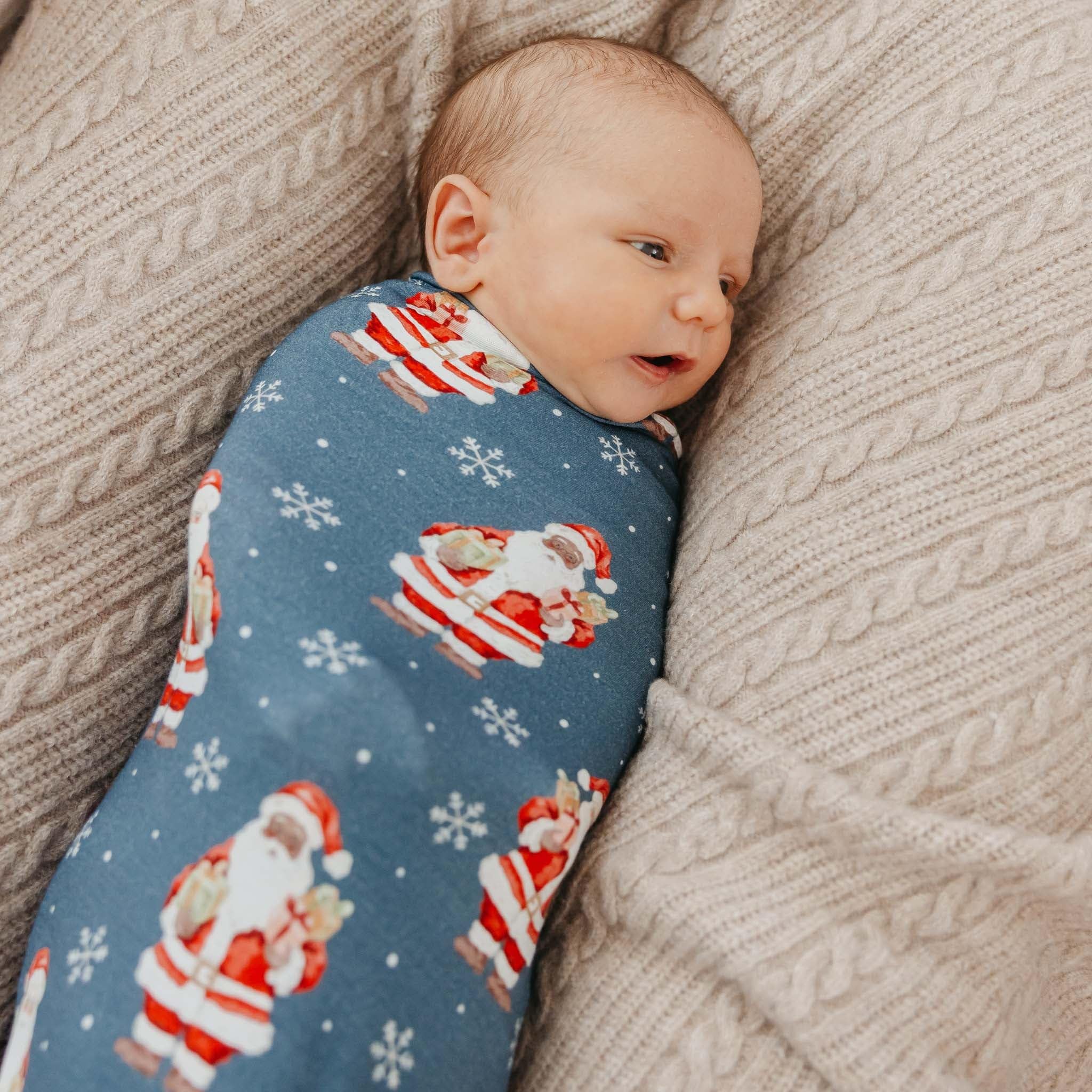 Copper Pearl Santa Claus swaddle during tummy time, lightweight cover option
