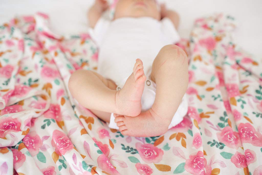 Copper Pearl Siena swaddle blanket on baby breathable fabric helps cozy, lightweight comfort