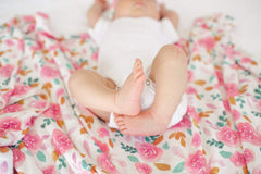 Copper Pearl Siena swaddle blanket on baby breathable fabric helps cozy, lightweight comfort