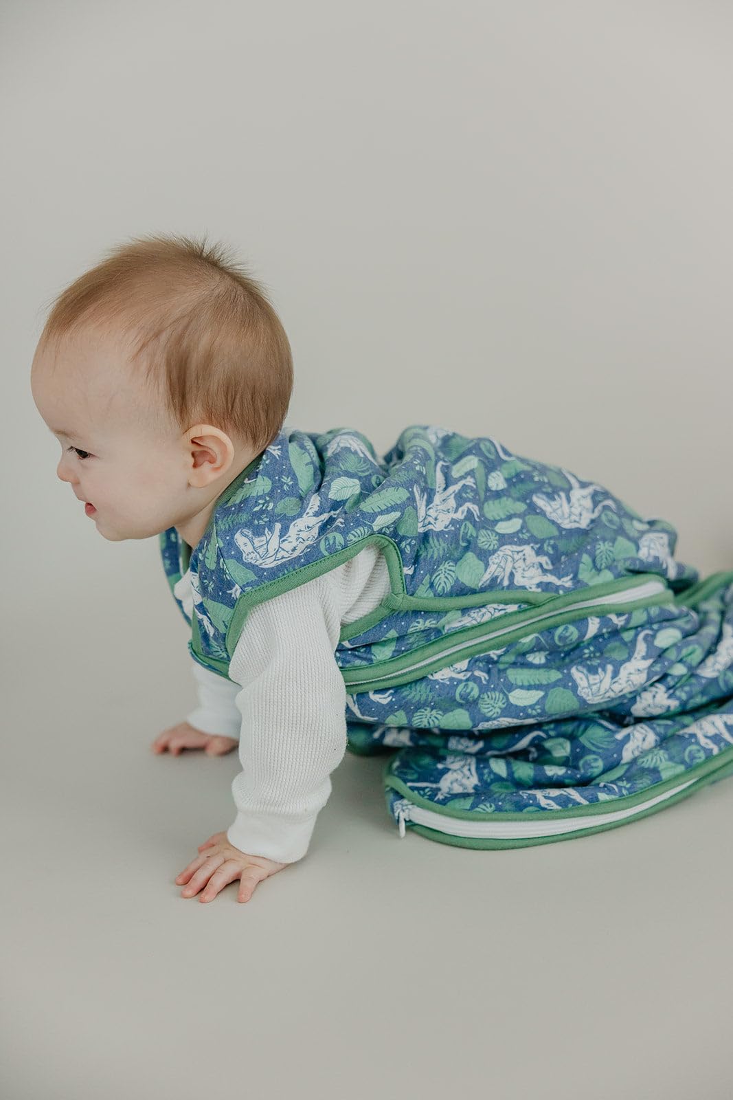 Copper Pearl Sleep Sack pairs with nursery prints for cohesive decor.