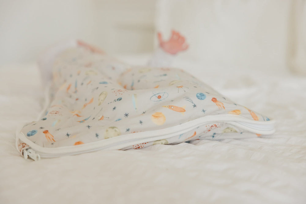 Copper Pearl Sleep Sack cosmos pattern adds stylish nursery decor.