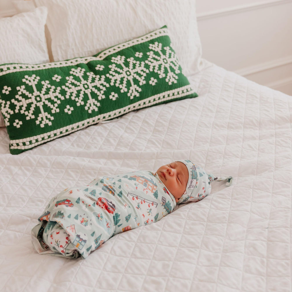 Copper Pearl Snowy Slopes knit blanket on a stroller for on-the-go comfort.