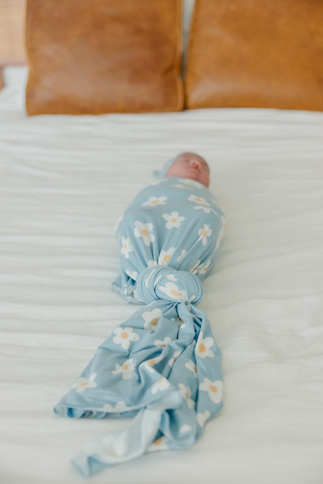 Copper Pearl stroller shield blanket protecting baby on outings.