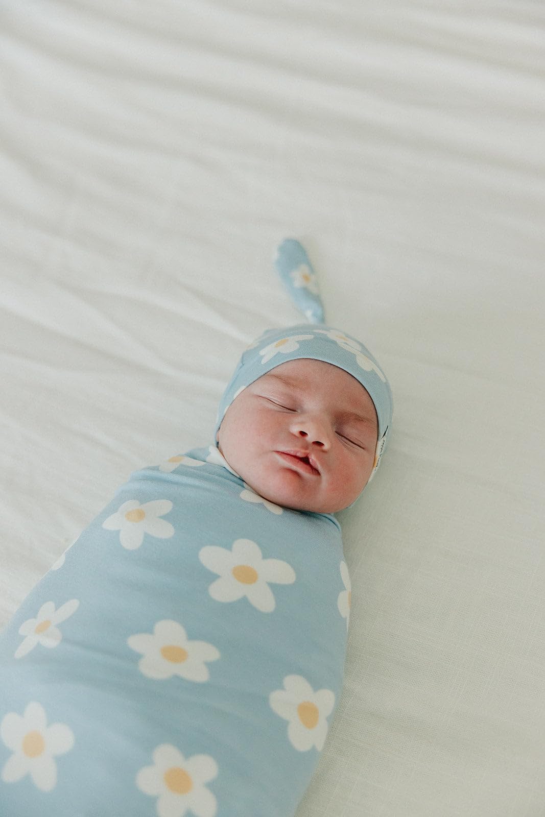 Copper Pearl stylish prints swaddle blanket coordinating with outfits.