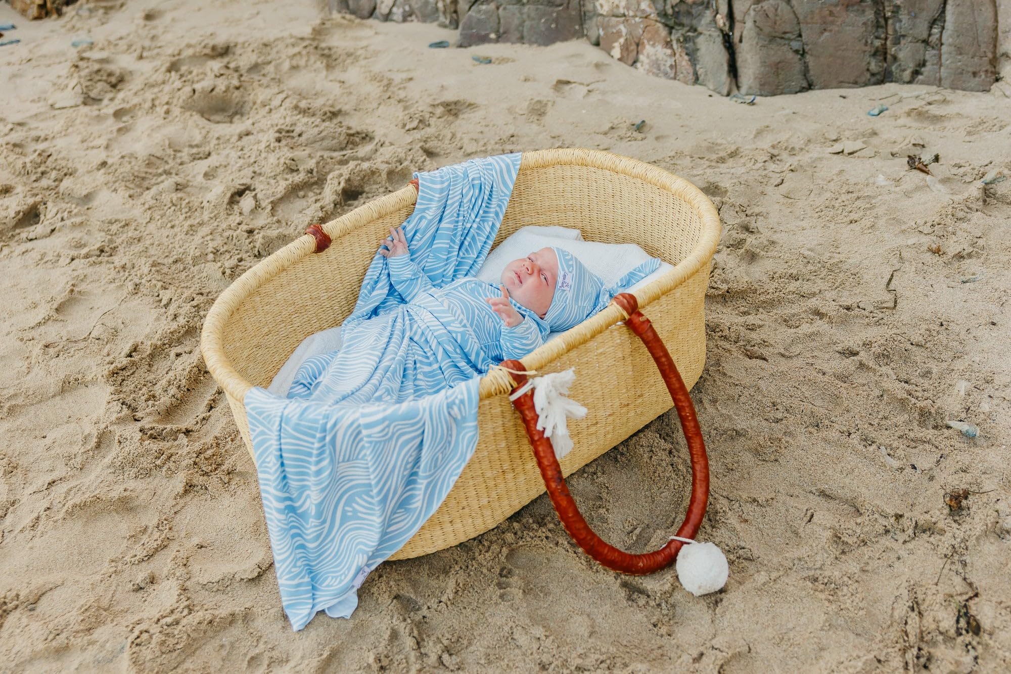 Copper Pearl Surf swaddle blanket airy fabric wraps baby without overheating.