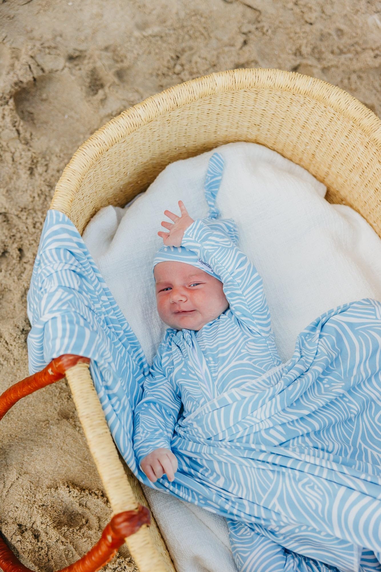 Copper Pearl Surf swaddle blanket stylish print pairs with outfits and gear.