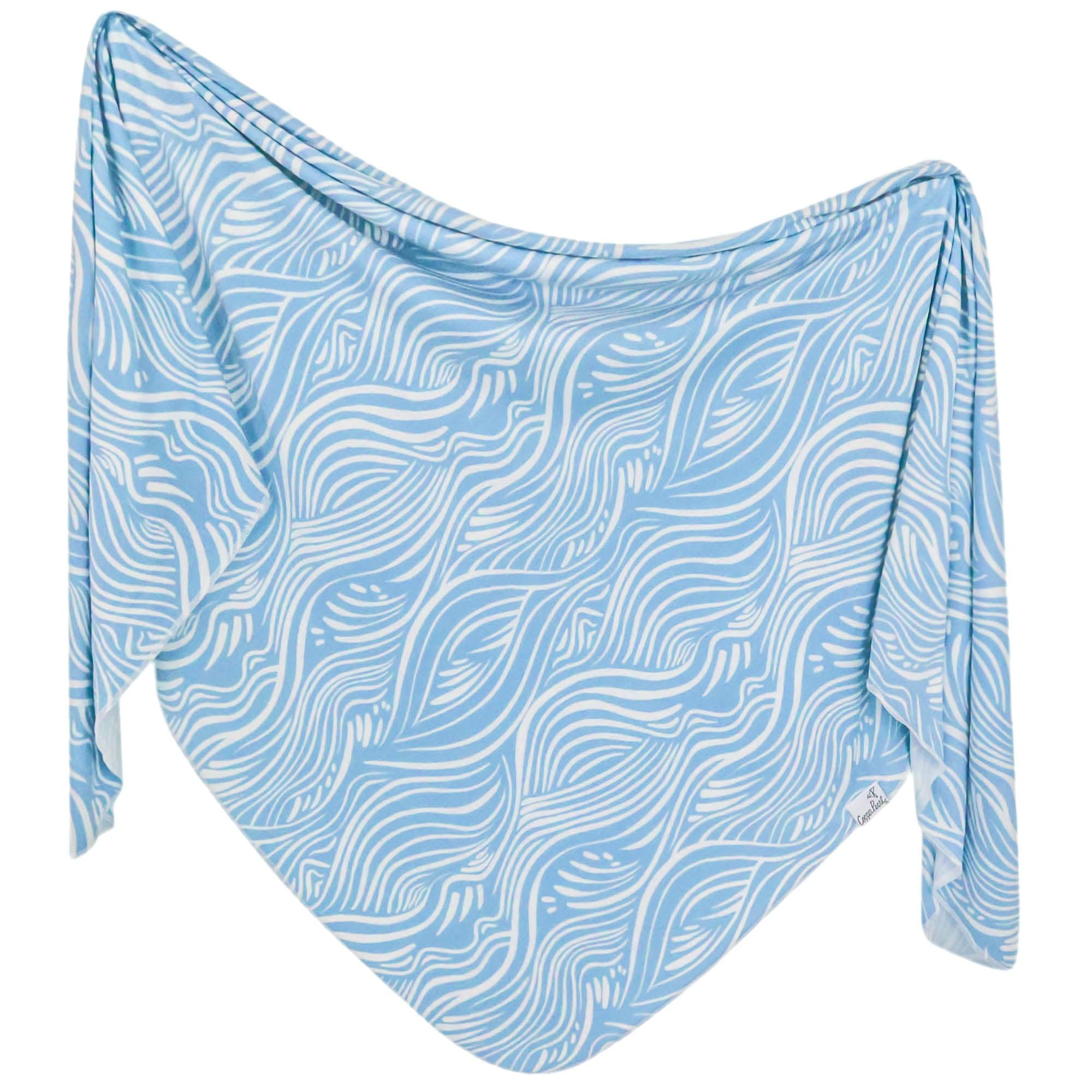 Copper Pearl Surf swaddle blanket close-up shows soft fabric for cozy, breathable baby comfort.