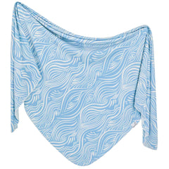 Copper Pearl Surf swaddle blanket close-up shows soft fabric for cozy, breathable baby comfort.