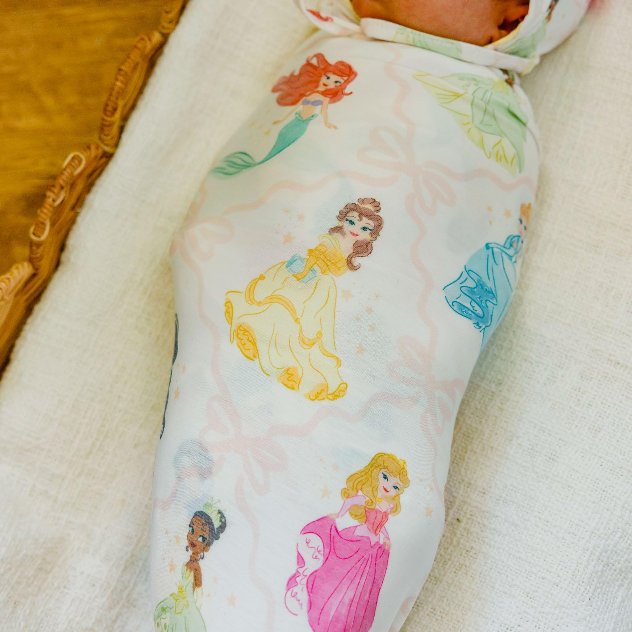 Copper Pearl Disney Princess swaddle used as a tummy time mat