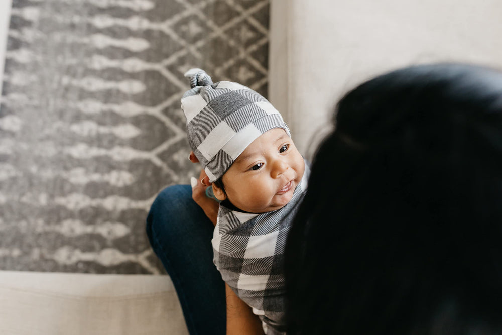 Copper Pearl stylish-prints swaddle blanket supports coordinated baby outfits.