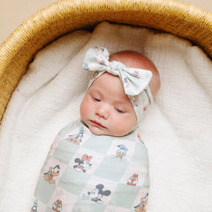 Copper Pearl swaddle Mickey Mouse and Friends stretched fabric shows generous size for growing babies.