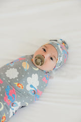 Copper Pearl swaddle serving as nursing cover for convenient feeding on the go.