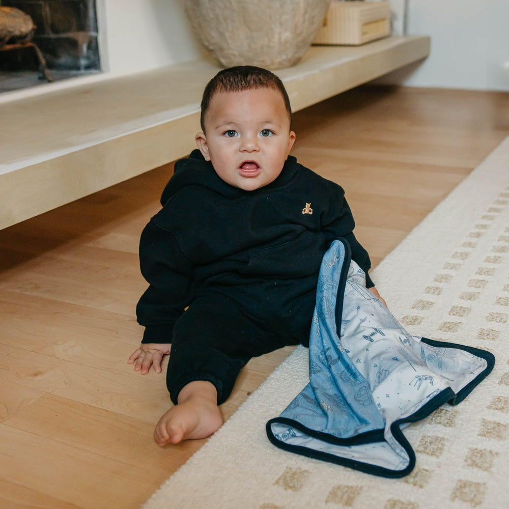 Copper Pearl travel-ready blanket fits diaper bag or stroller.
