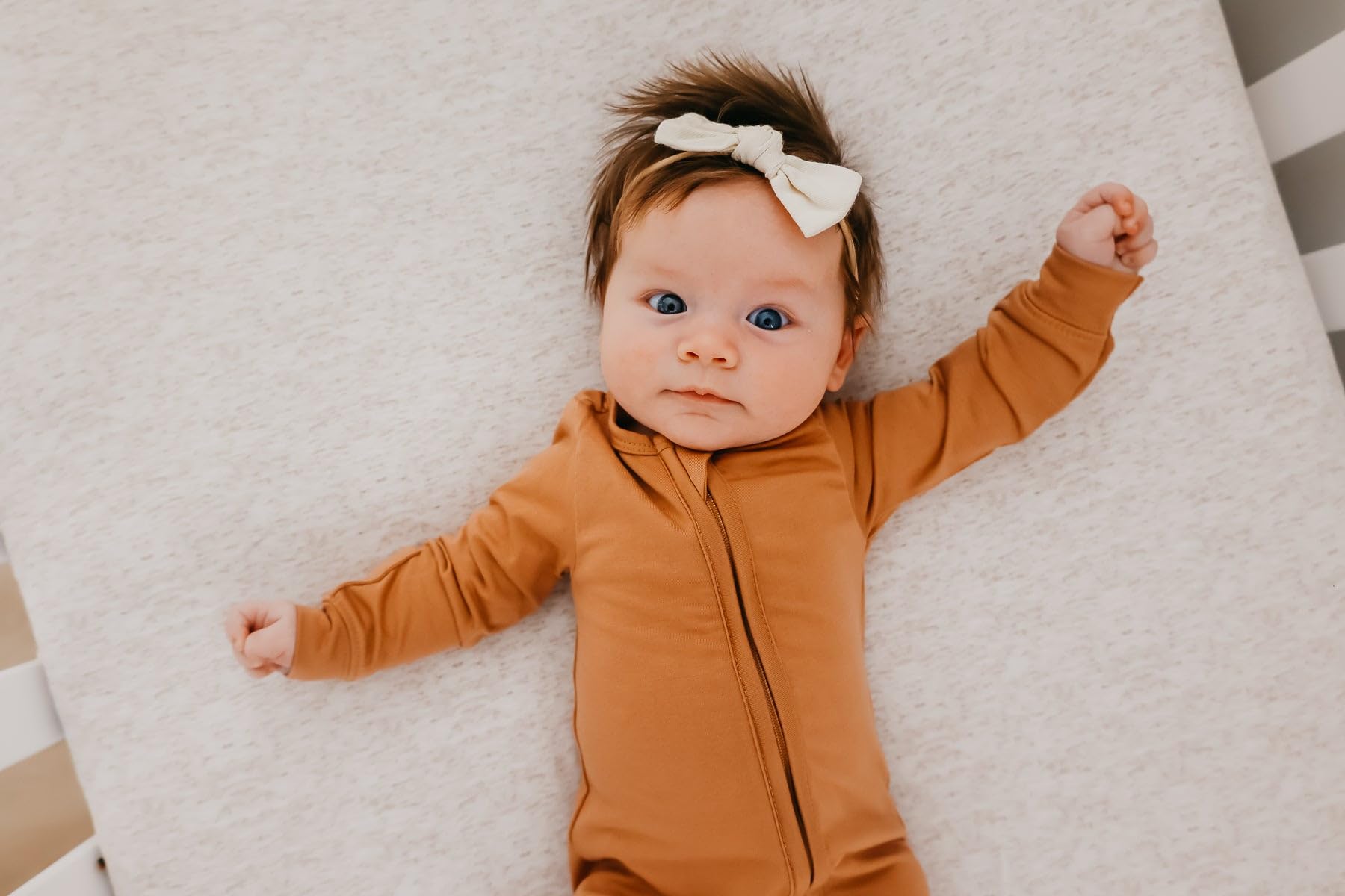 Copper Pearl zip-up footie pajama available in newborn to 24 months.