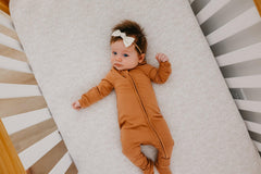 Copper Pearl zip-up footie pajama tag-free neck prevents irritation.