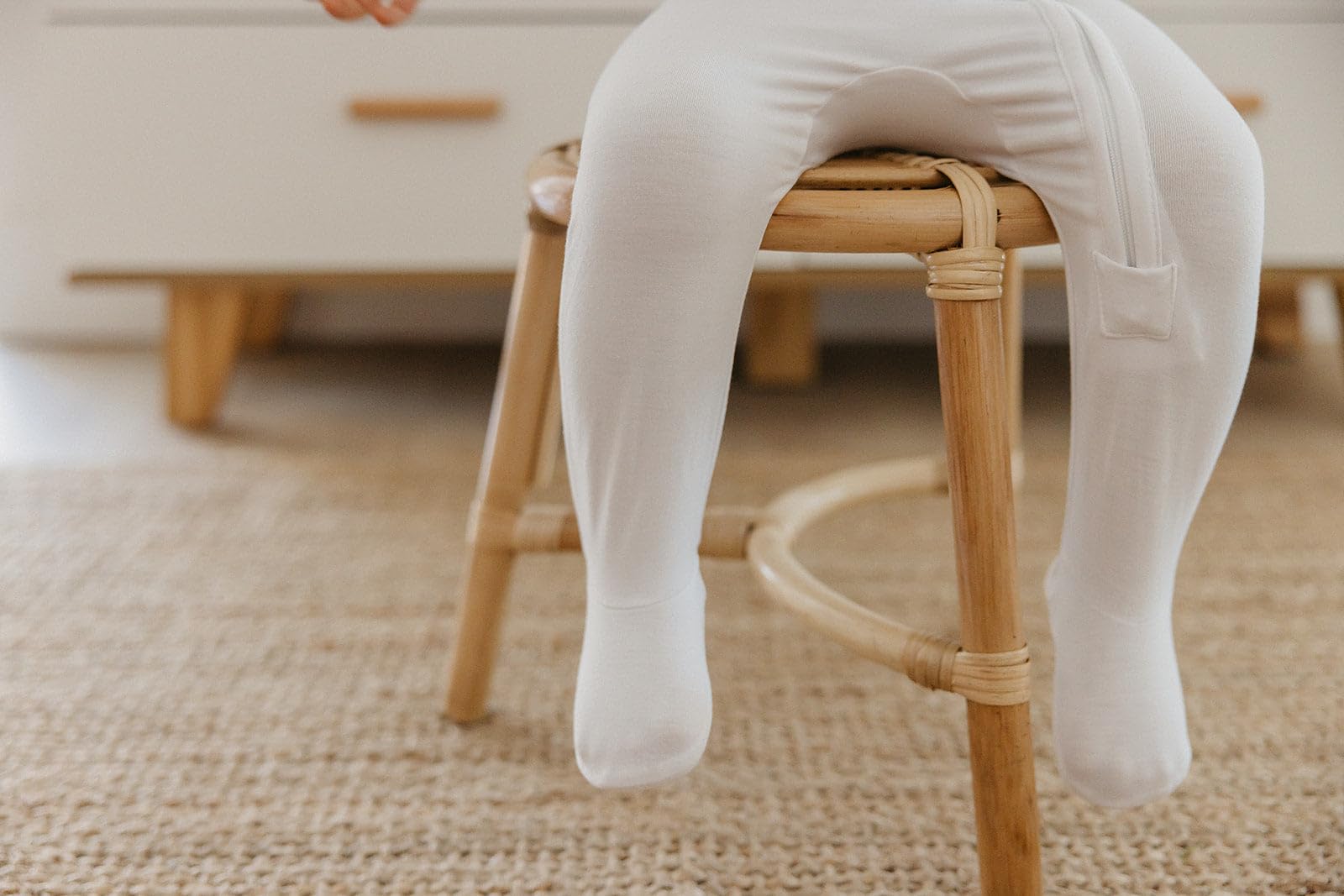 Copper Pearl zip-up footie with trendy prints, stylish baby apparel.