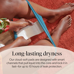 Cora back-coverage maxi pad with leak-resistant side barriers.