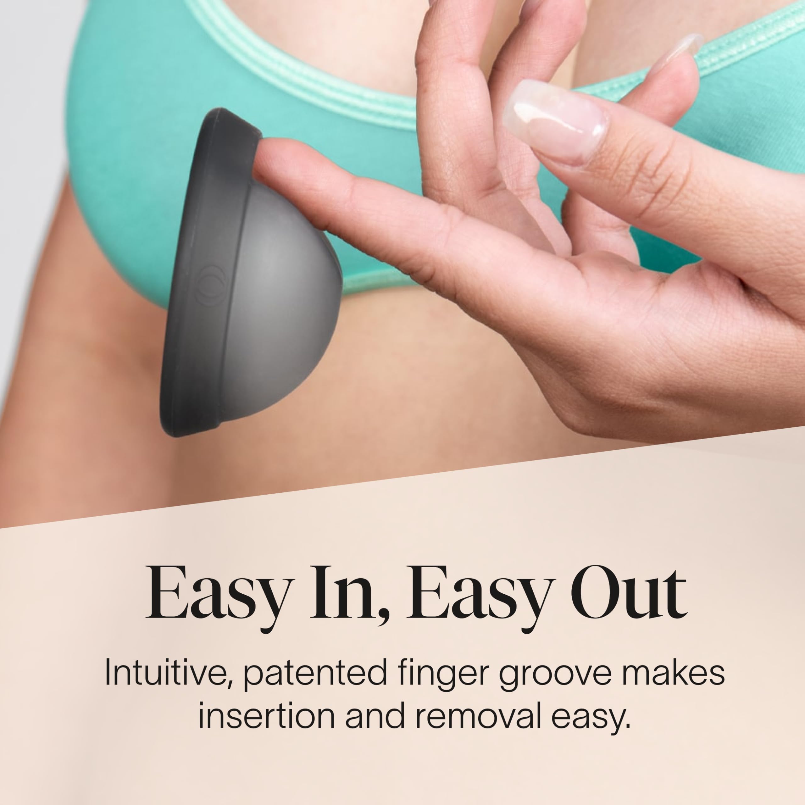 Cora Menstrual Disc Charcoal in hand, portable reusable period protection