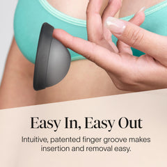Cora Menstrual Disc Charcoal in hand, portable reusable period protection