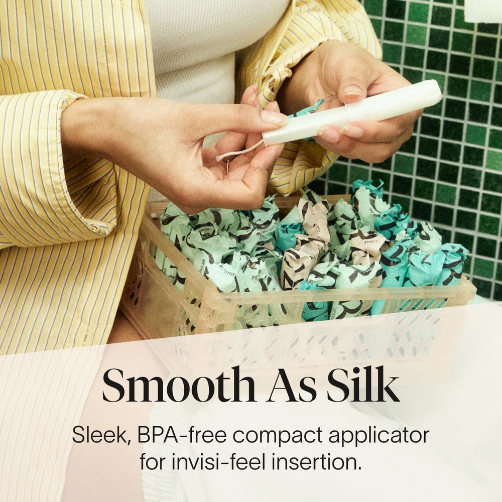 Close-up of Cora organic tampon with 100% organic cotton and soft touch applicator.