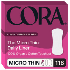 Cora topsheet organic cotton liner on soft surface, highlighting natural texture and skin-friendly feel.