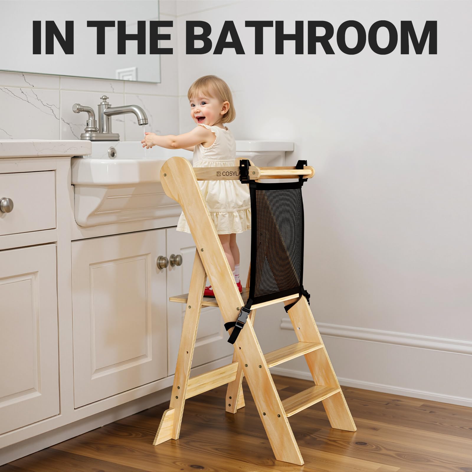 COSYLAND child using the stool at the sink for independent participation.