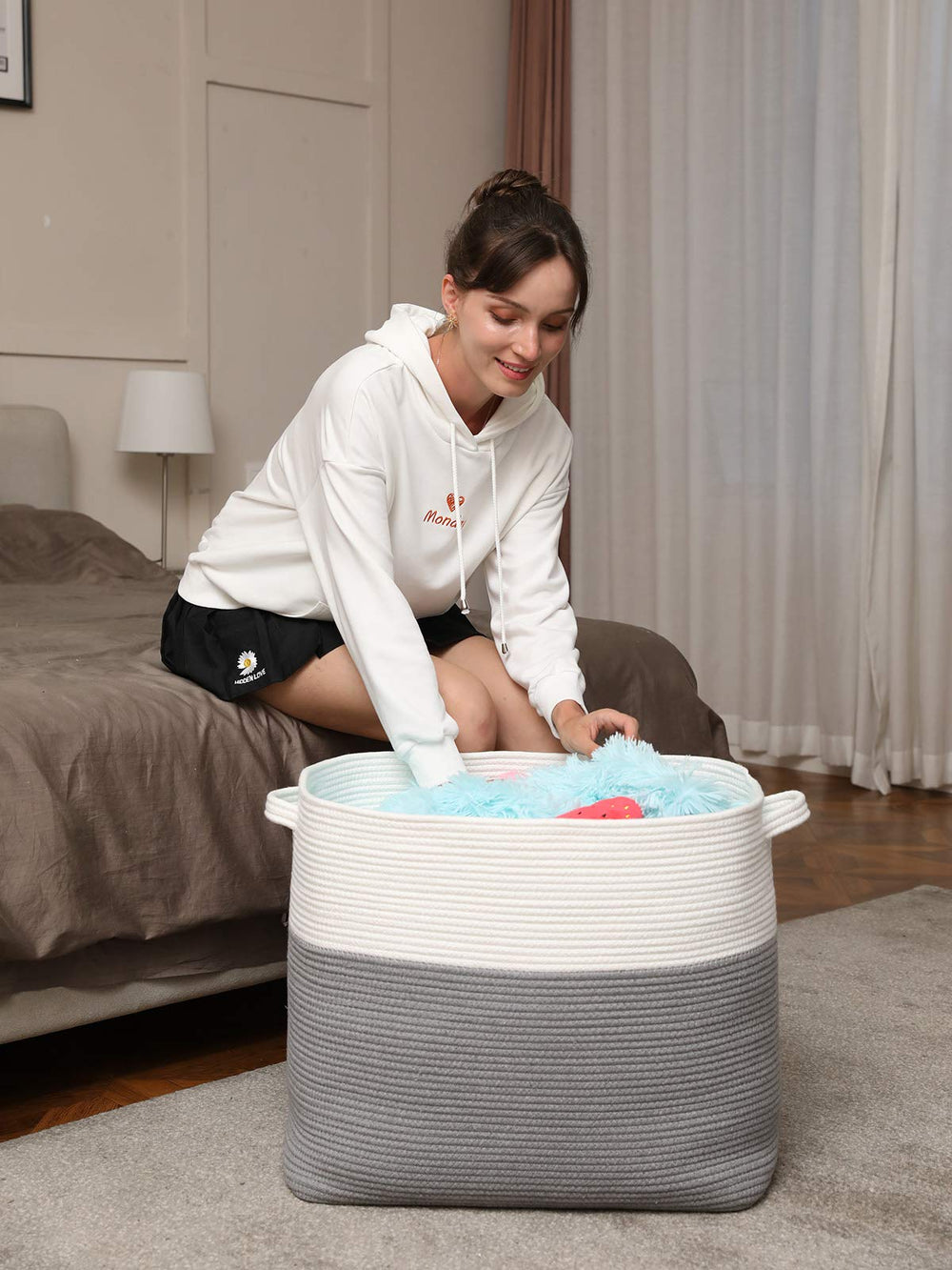 Cottonphant blanket storage basket keeps textiles organized in bedrooms or laundry.