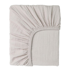 Cottonsis Muslin crib sheet close-up shows ultra-soft fabric for newborn comfort.