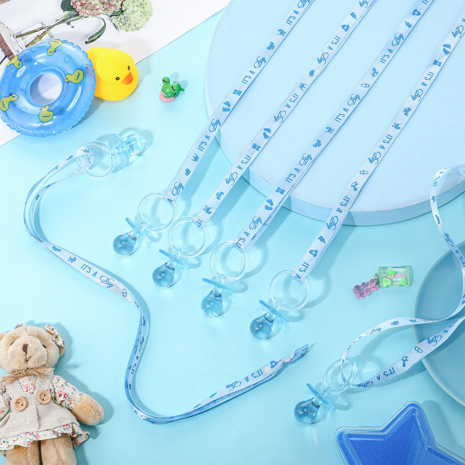 Coume blue pacifier necklaces serve as charming party favors for boys