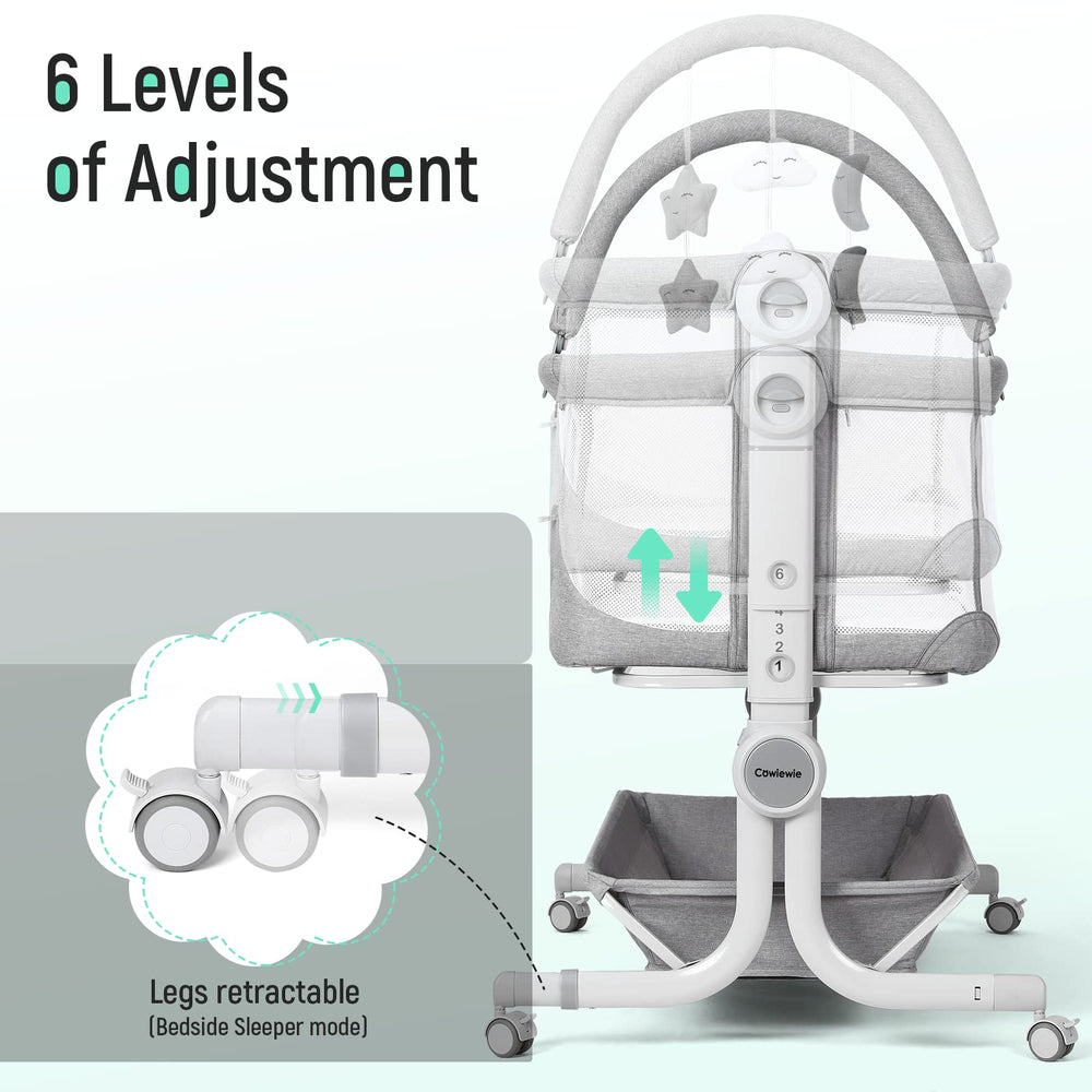 Cowiewie bassinet features black and white toys to entertain newborns.