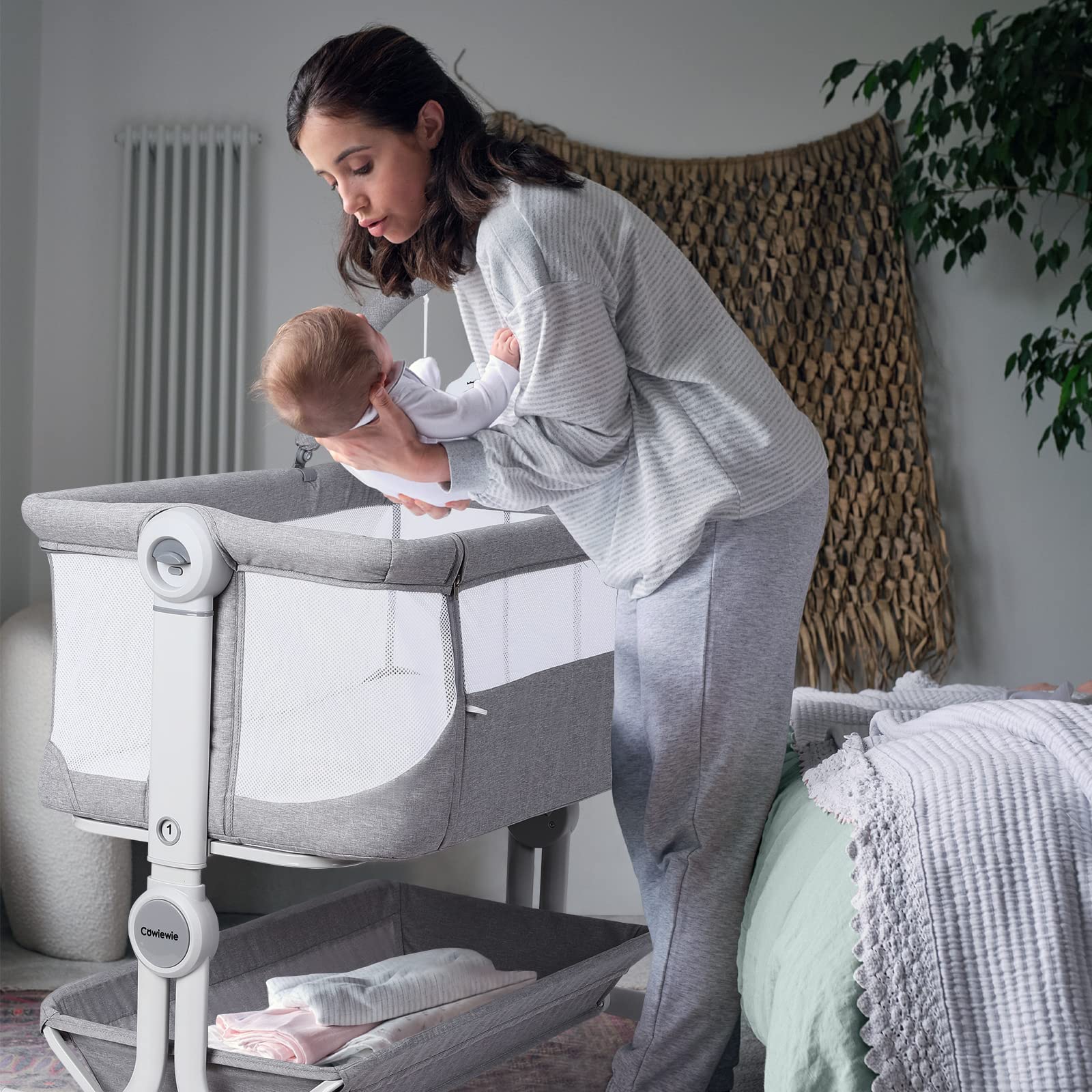 Cowiewie bassinet wheels enable smooth movement from bed to sofa area.