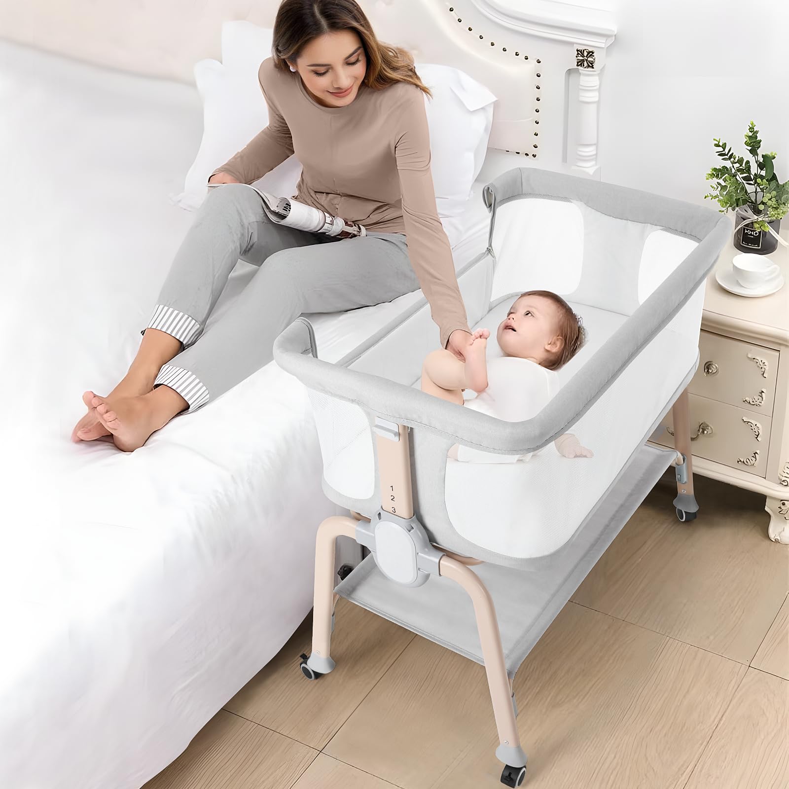 Cowiewie bassinet bedside sleeper fully assembled beside a bed for nighttime feeds.