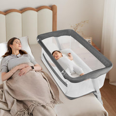 Cowiewie bassinet beside bed with secure attachment for nighttime care.