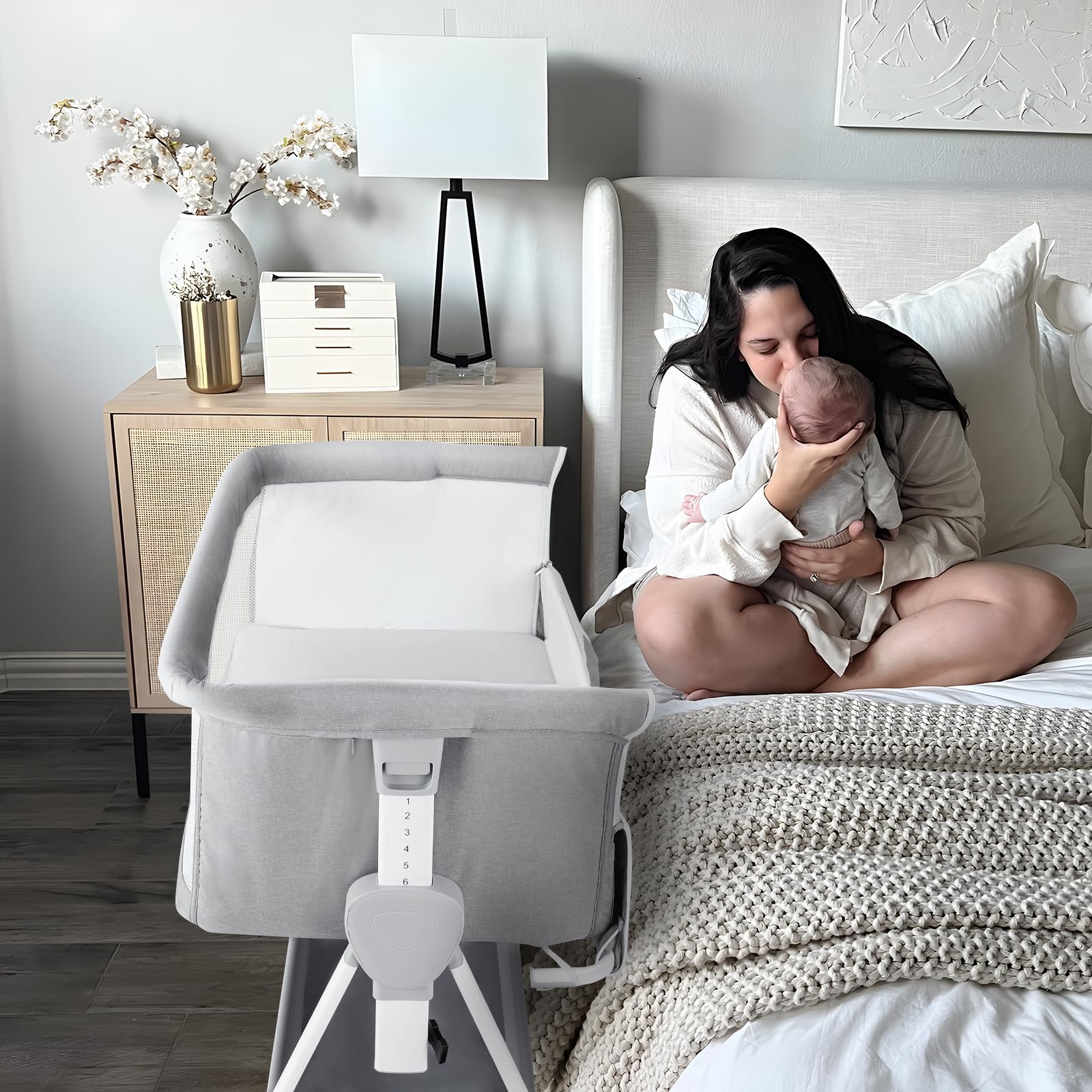Cowiewie bassinet with silent wheels gliding smoothly beside the bed.