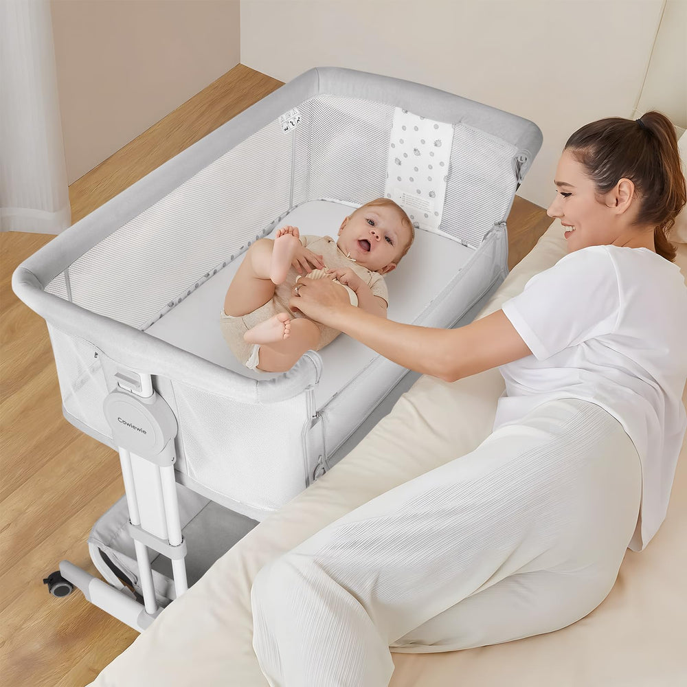 Cowiewie Bassinet storage basket keeps diapers, wipes, and essentials within arm's reach.