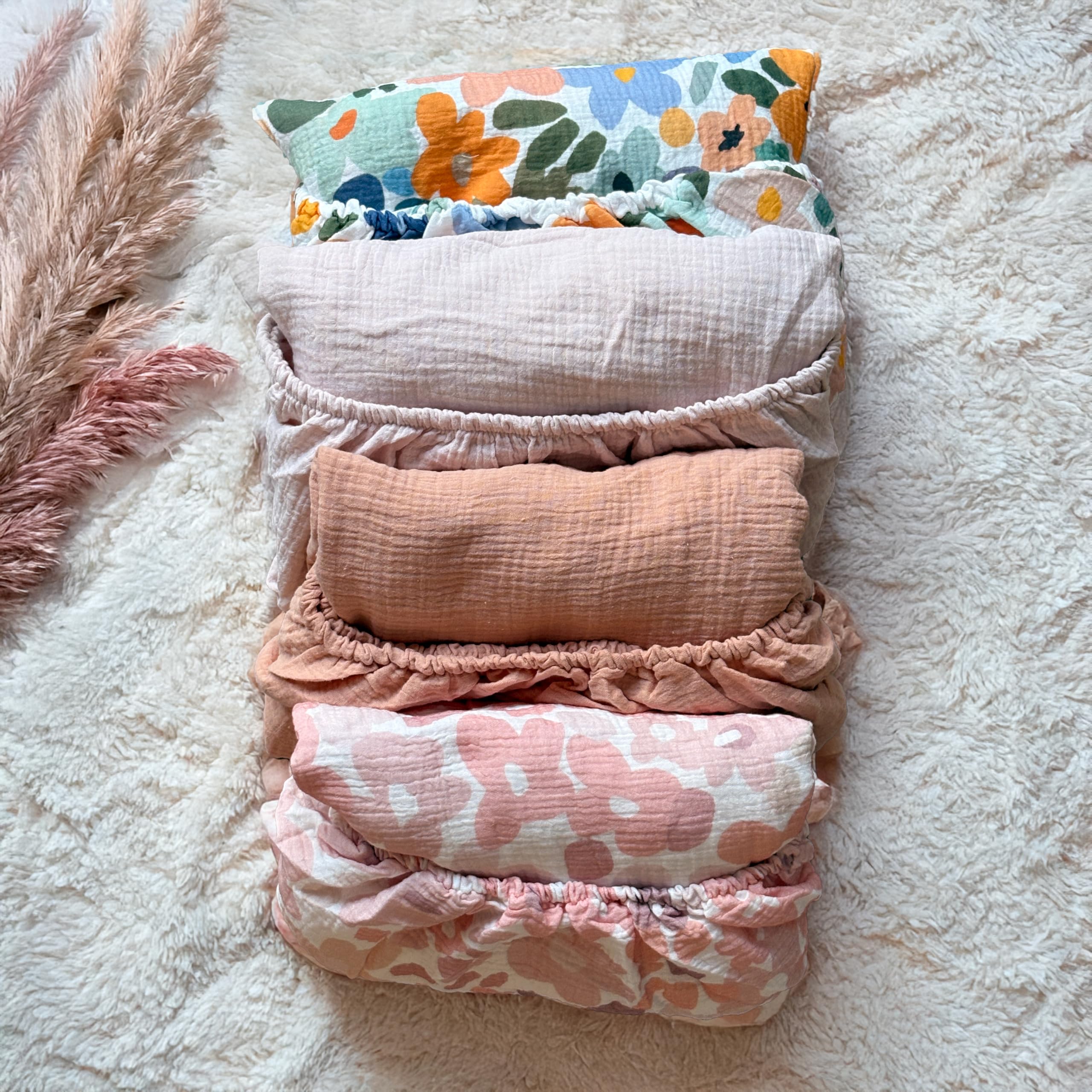 CozysBunny muslin crib sheet brightens nursery decor with flowers.