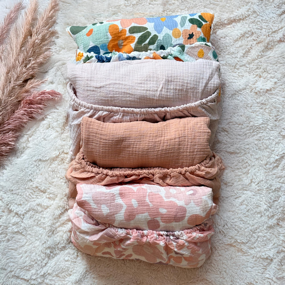 CozysBunny muslin crib sheet brightens nursery decor with flowers.
