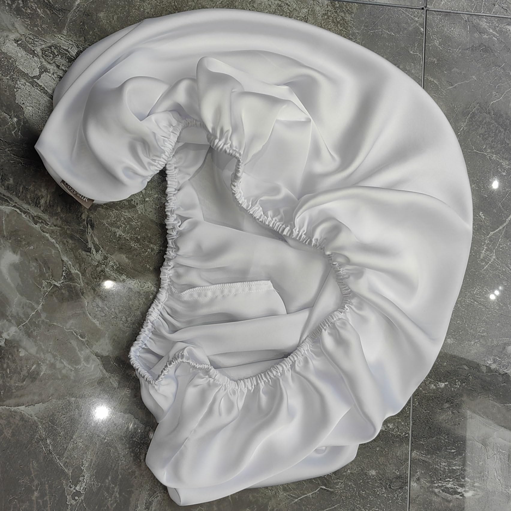 Cozysilk elastic-edge bassinet sheet stays securely fit on mattresses