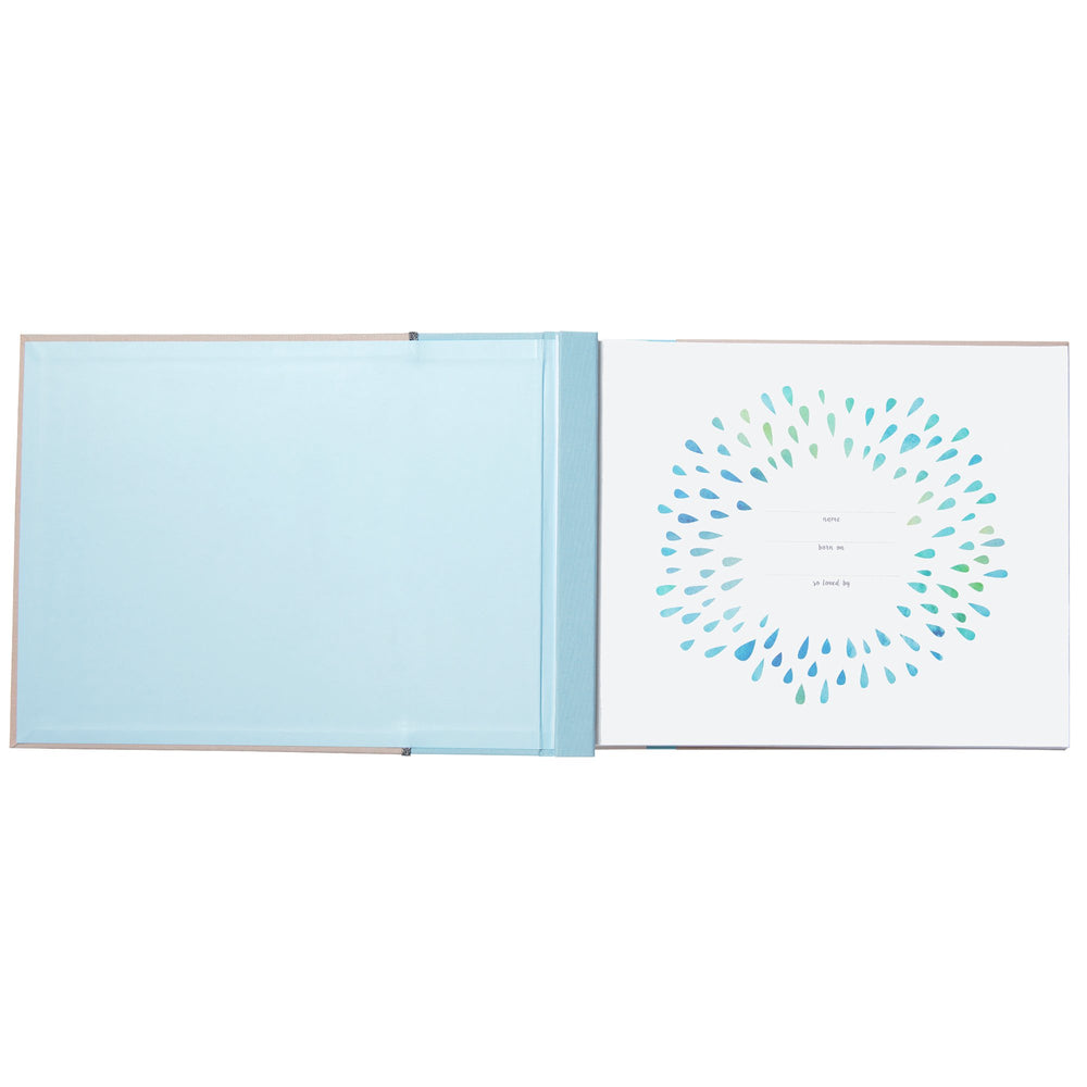 Blue memory book spine featuring nautical design and ribbon accent