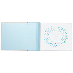 Blue memory book spine featuring nautical design and ribbon accent