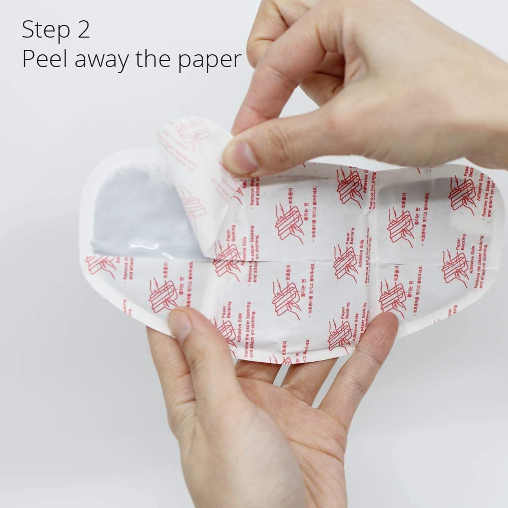 User applies CrampCareH patch to underwear for hands-free comfort.