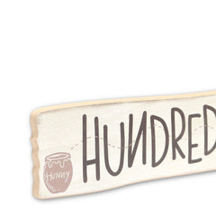 Cream background with distressed finish sign adds vintage character to walls