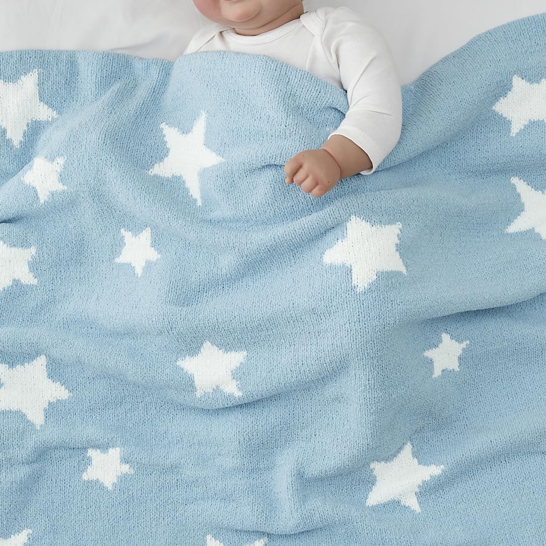 CREVENT blue star blanket used as stroller cover for on-the-go warmth