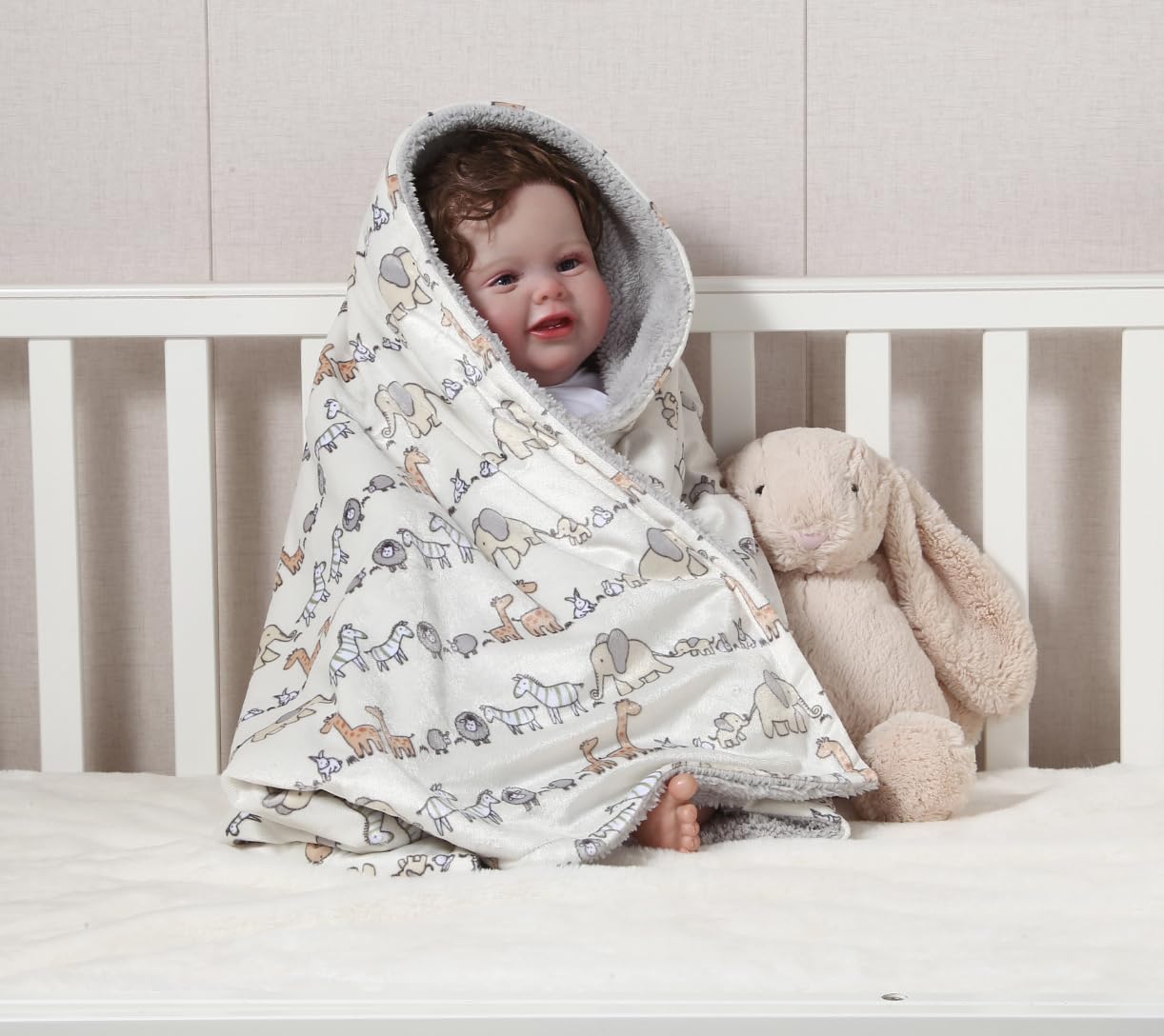 CREVENT Minky animal blanket in crib as nursery comfort.